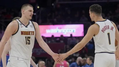 Majkl Porter Džunior i Nikola Jokić (AFP)