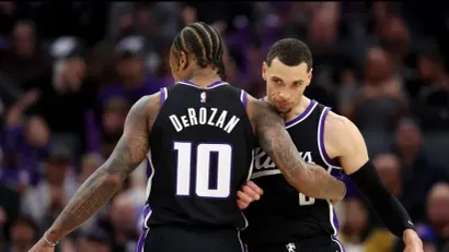 Demar Derozan i Zek Lavin (AFP)