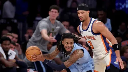 Dža Morant i Džoš Hart (AFP)