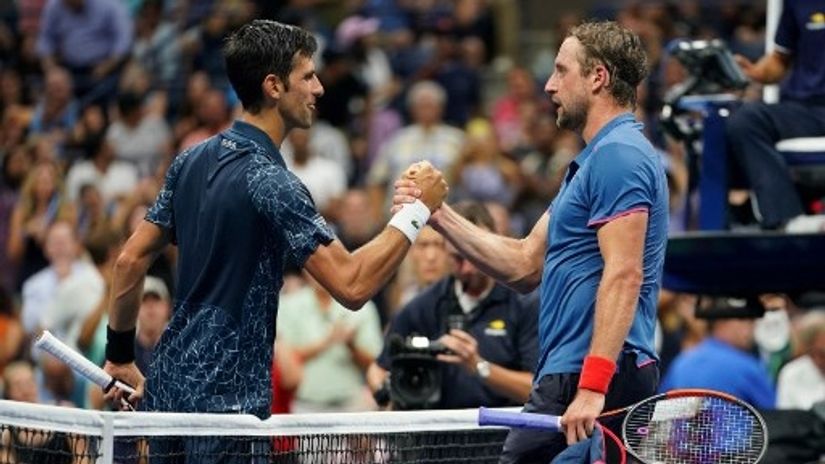 Novak Đoković i Tenis Sandgren (©AFP)