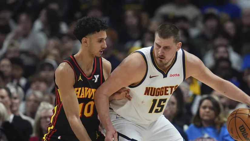 Zakari Rizaše i Nikola Jokić (Guliver/AP Photo/David Zalubowski)