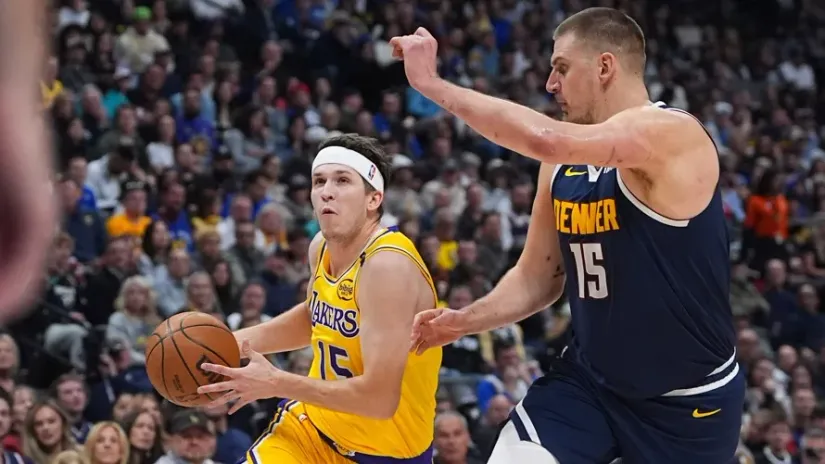 Nikola Jokić i Ostin Rivs (©Guliver/AP Photo/David Zalubowski)