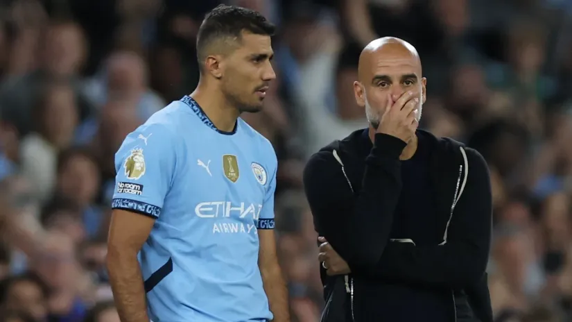 Rodri i Pep Gvardiola (©Reuters)