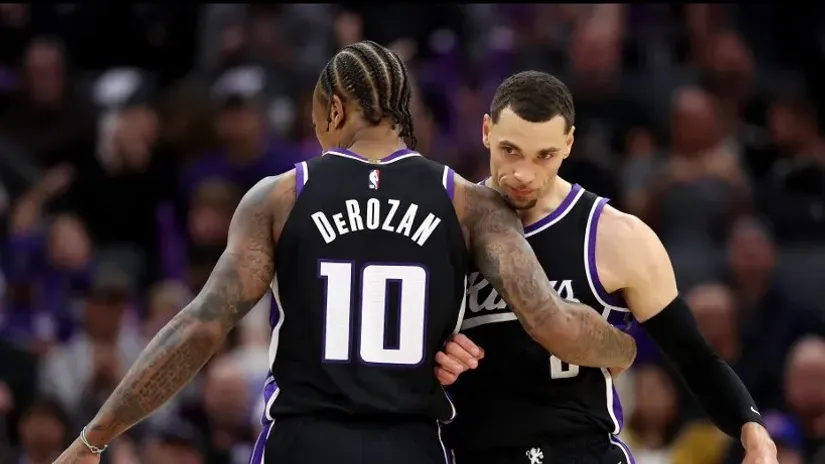 Demar Derozan i Zek Lavin (AFP)