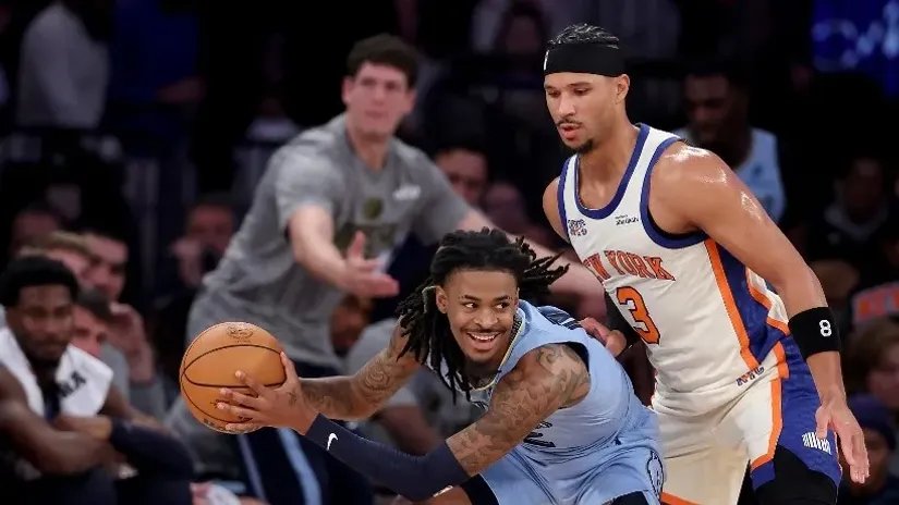 Dža Morant i Džoš Hart (AFP)