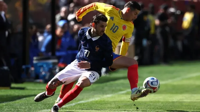 Hames Rodrigez i Lukas Ernandez (©Reuters)