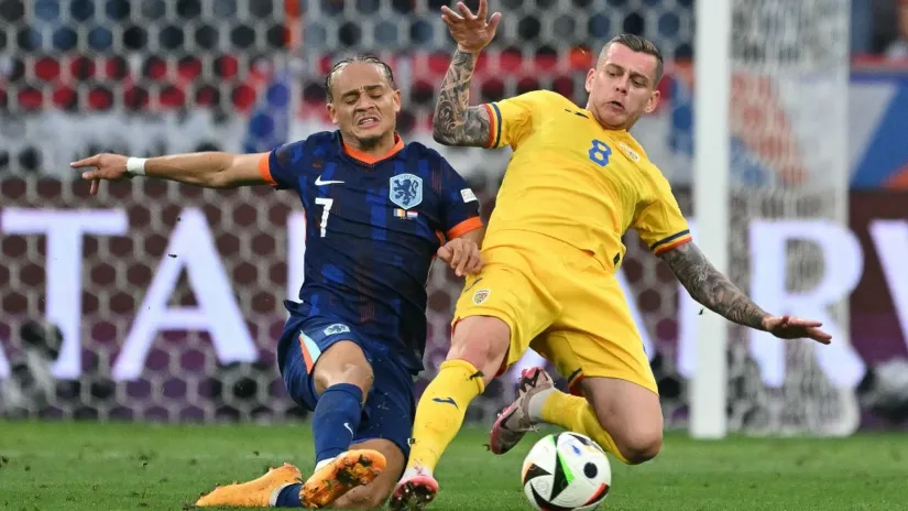 Aleksandru Kikaldau (desno) u dresu Rumunije (©AFP)
