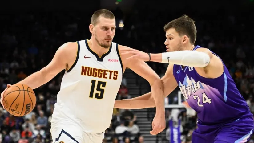 Nikola Jokić i Voker Kesler (AFP)